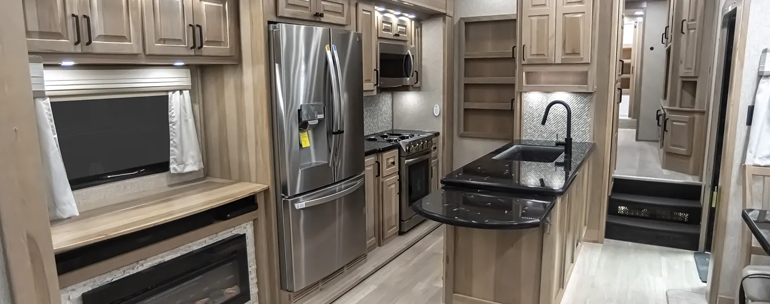Hardwood hickory interior of luxury fifth wheel toy hauler, built by Luxe Fifth Wheel in Elkhart Indiana.