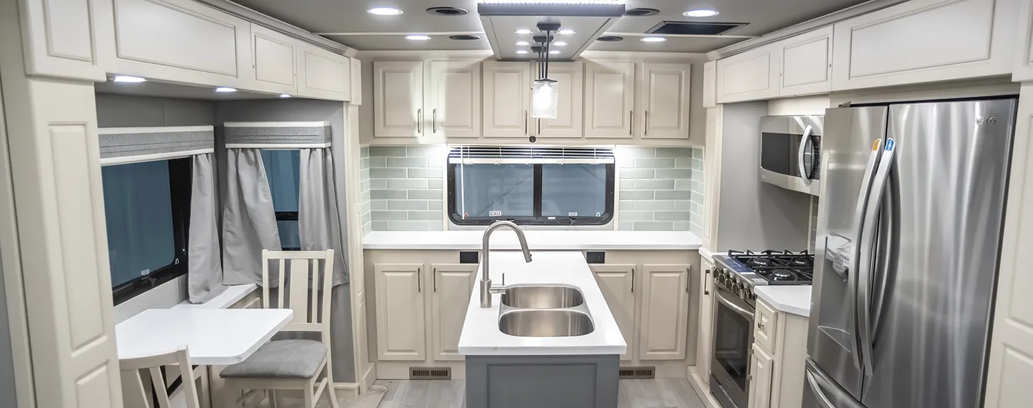 A rear kitchen luxury fifth wheel design, built by Luxe Fifth Wheel out of Elkhart Indiana.